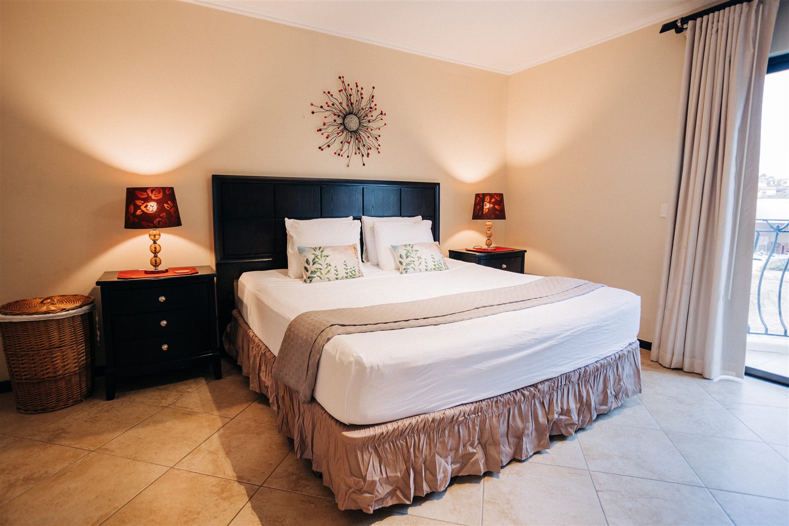 Main bedroom with king bed and balcony access