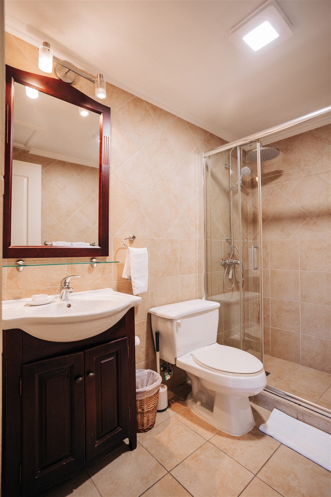 Main ensuite bathroom with vanity and shower
