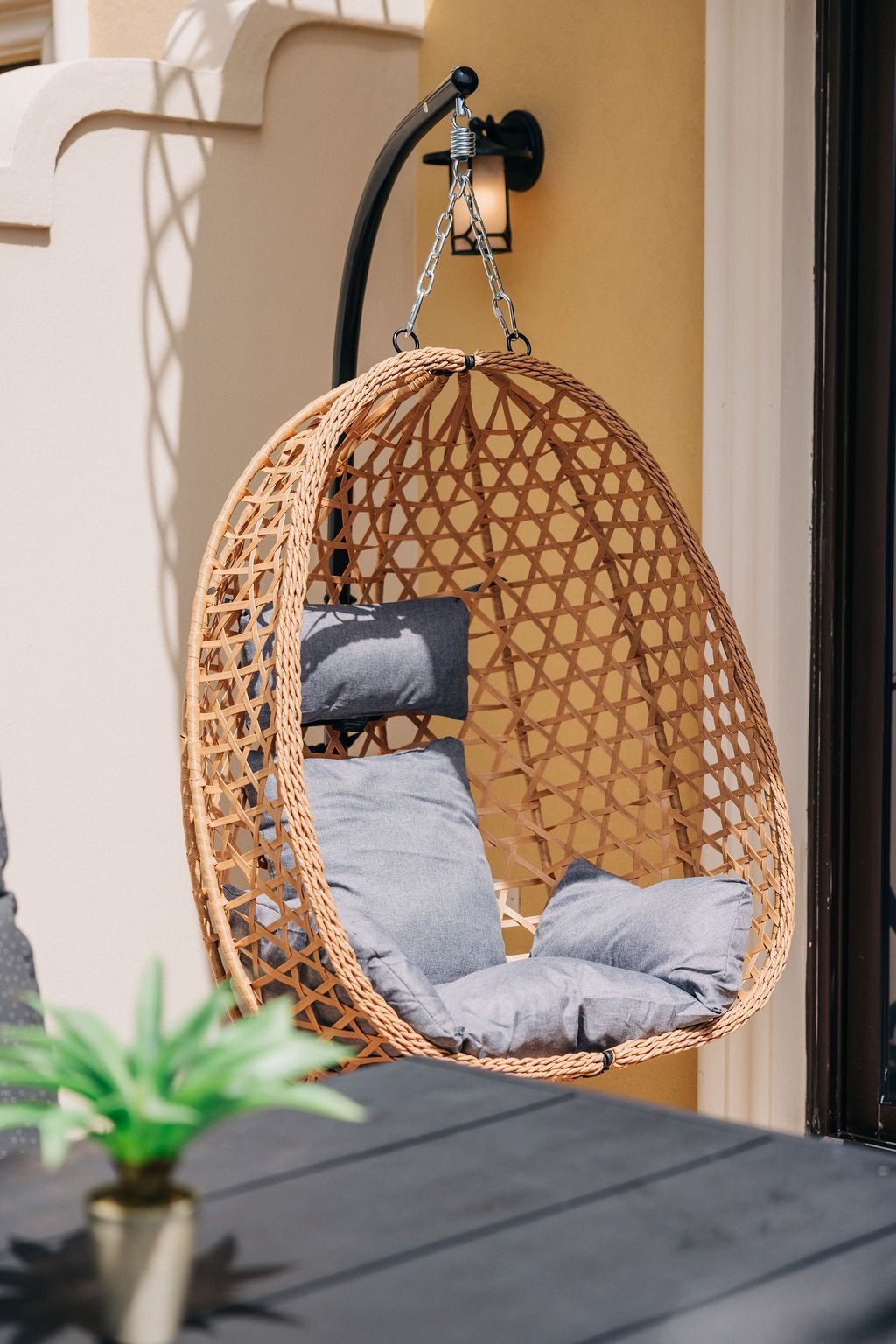 Woven hanging chair on the patio