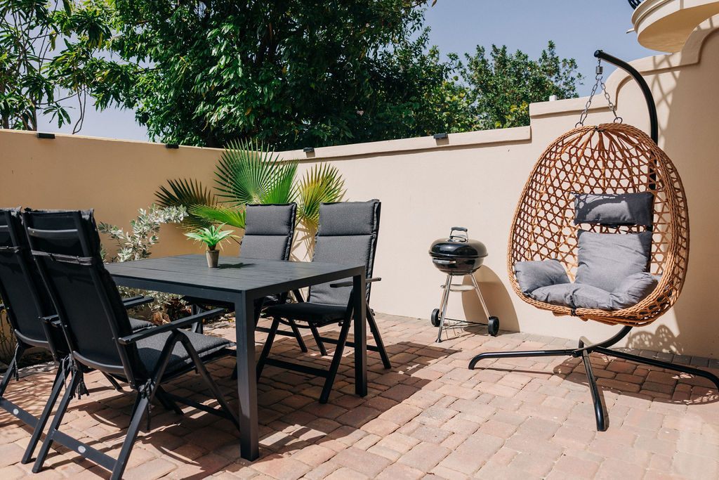 Outdoor dining table and hanging chair